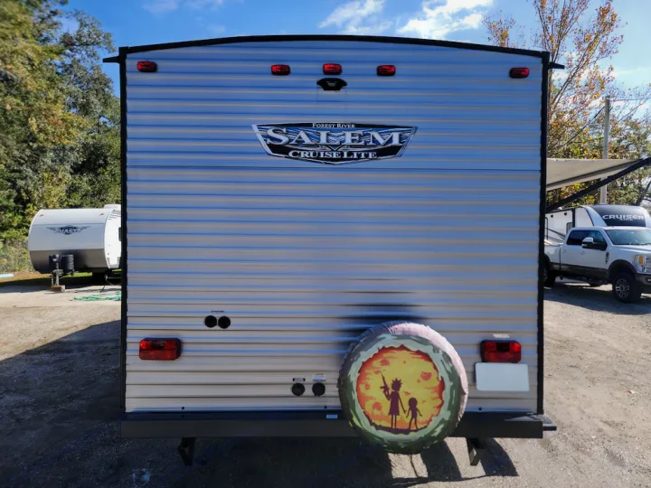 Ready for your next adventure: Rear view of a silver Salem Cruise Lite RV rental with a fun Rick & Morty spare tire cover.. Forest River Salem Cruise Lite 2020