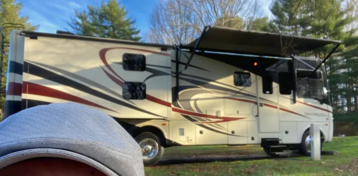 Enjoying the outdoors with this spacious RV rental. A Georgetown XL motorhome with awning extended at a sunny campsite.. Georgetown XL 2015
