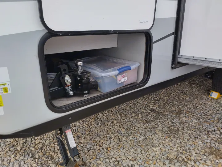 RV rental: Open exterior storage with a weight distribution hitch and clear plastic bin, parked on gravel.. Forest River Other 2022