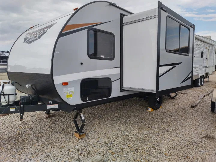 A modern gray and white travel trailer with an extended slide-out. Perfect for your next rv rental adventure!. Forest River Other 2022