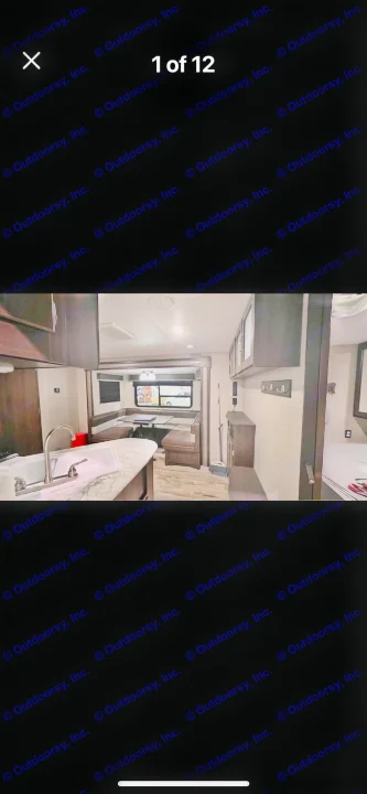 Tour this RV rental's inviting interior: fully equipped kitchen, comfy dinette, and private bedroom nook.. Keystone RV Springdale 2019