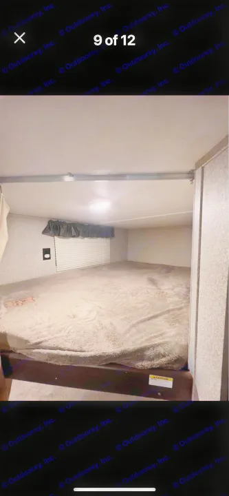 Compact RV rental bunk bed offers a comfy sleeping area with window, outlet & light.. Keystone RV Springdale 2019