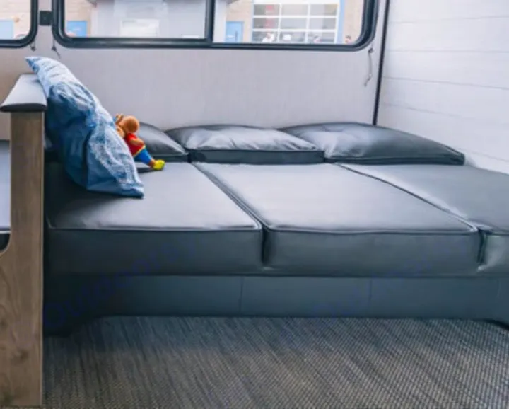 RV rental interior: Modular gray cushions create versatile seating and bed, offering comfort for your adventures.. Heartland Pioneer 2022