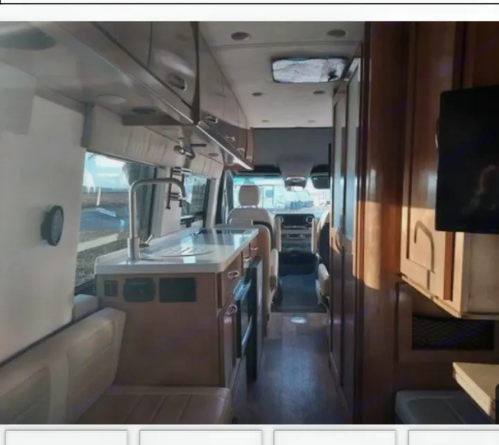 Inside this RV rental: A modern interior featuring a kitchenette, overhead storage, and a view to the front cabin.. Coachmen Galleria Li 3 (24Q) 2021