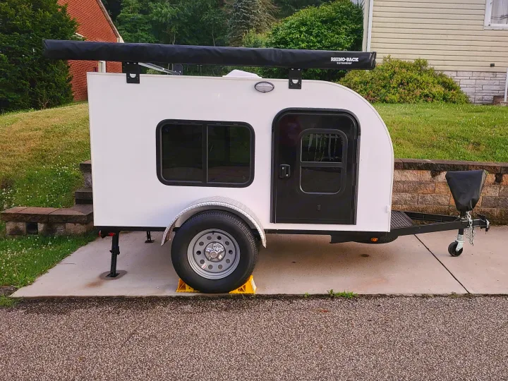 The exterior is very simple and clean.. New Wave Teardrop Camper 5x8 with Kitchen Galley 2022