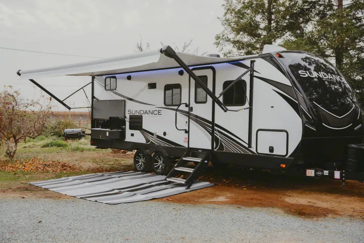 Experience nature with this Sundance Ultra Lite rv rental, fully set up with an awning and outdoor kitchen.. Heartland RVs Sundance Ultra Lite 2021
