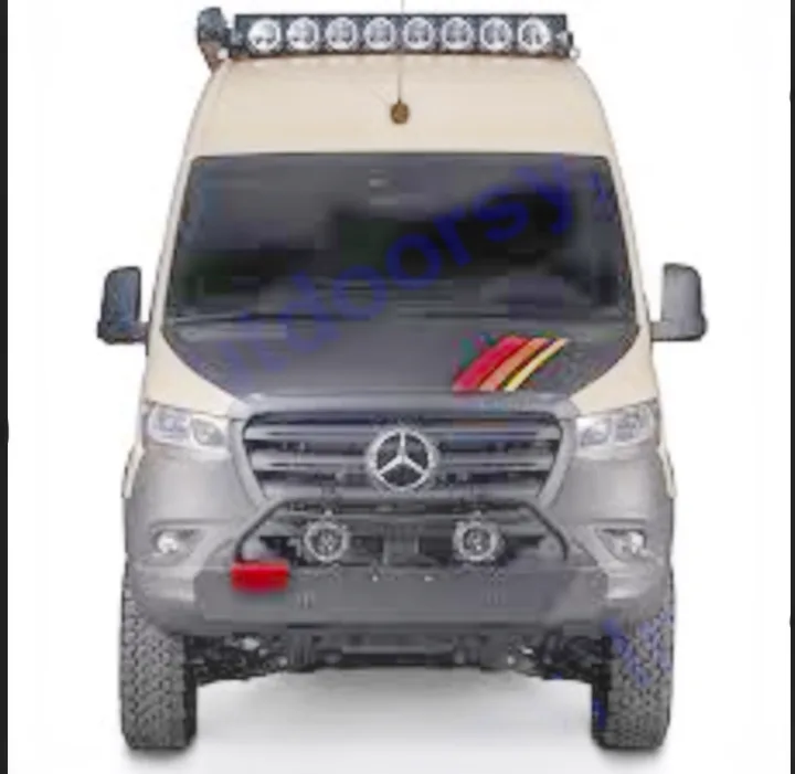 Front view: A tan & black Mercedes Sprinter adventure van, perfect for RV rental. Features off-road tires, bull bar & rooftop lights.. Storyteller Overland Beast Mode 2023
