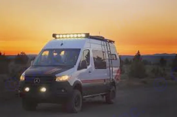 Adventure-ready RV rental! This off-road camper van with bright roof lights is perfect for exploring at sunset.. Storyteller Overland Beast Mode 2023