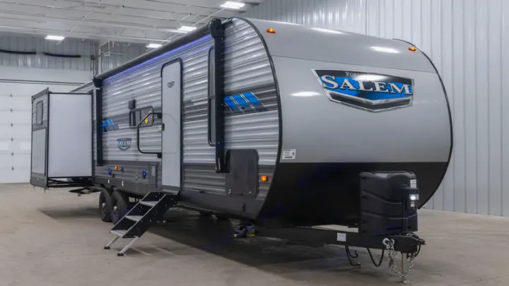 Sleek gray Salem travel trailer with extended awning, great for your next RV rental.. Forest River Salem 2021