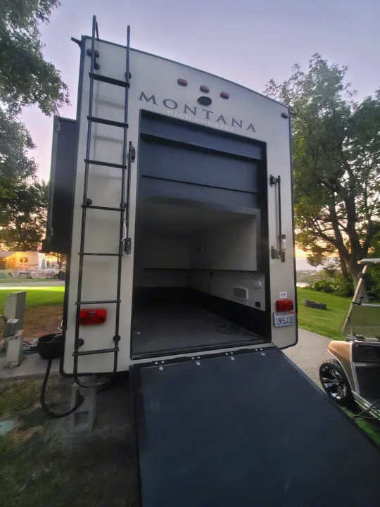 RV rental: Rear view of a Montana High Country toy hauler, ramp down, showcasing its spacious garage. Perfect for camping adventures.. Keystone RV Montana High Country Toy Hauler 2019