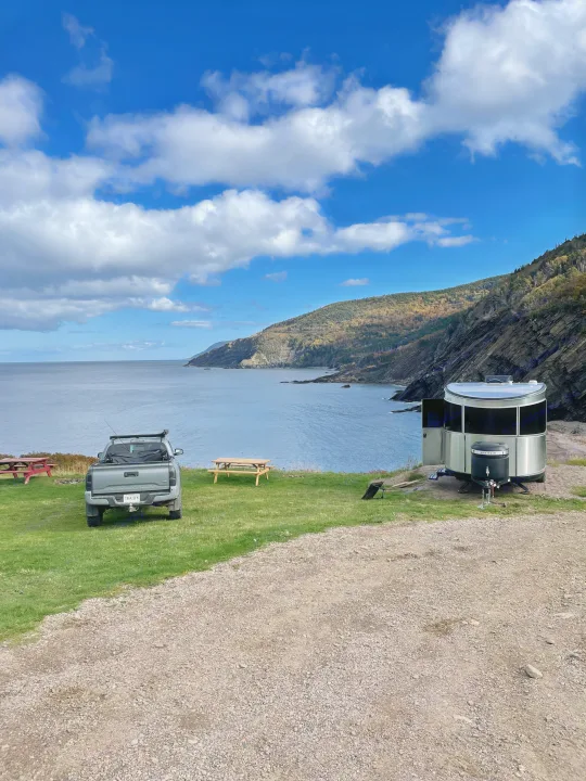 Stunning coastal RV rental spot with ocean views, a truck, and a travel trailer for scenic camping.. Airstream Basecamp 2022