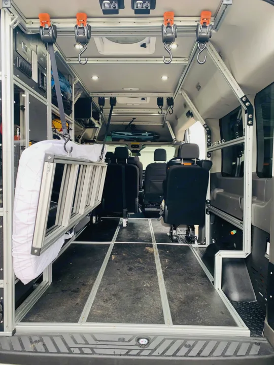 Aluminum-framed RV rental interior: modular storage, suspended ladder, flexible floor system for adventure.. Vandoit Vandoit Class B 2020