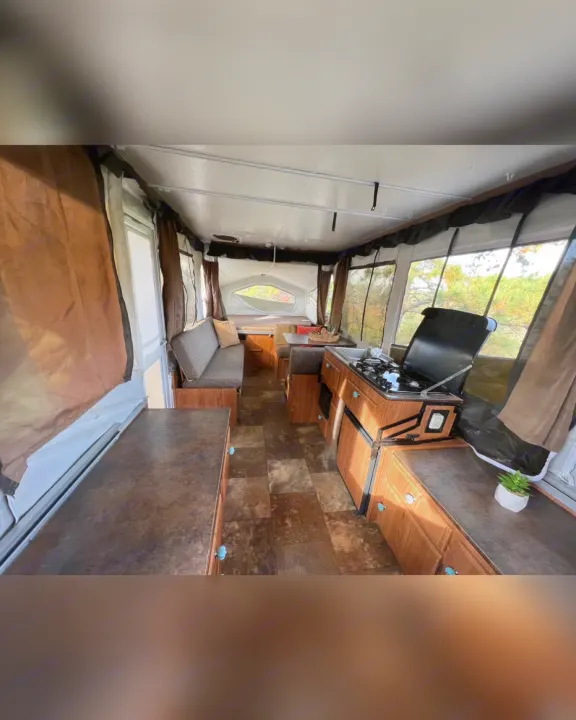 Inside this spacious pop-up RV rental: kitchen, dining, lounge, and sleep areas. Perfect for adventure!. Flagstaff/ForestRiver M.A.C.SeriesM-228 2016