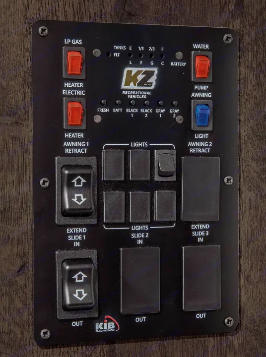 RV rental control panel displays tank levels and features switches for lights, awnings, and slide-outs.. Sportsmen SE 2021
