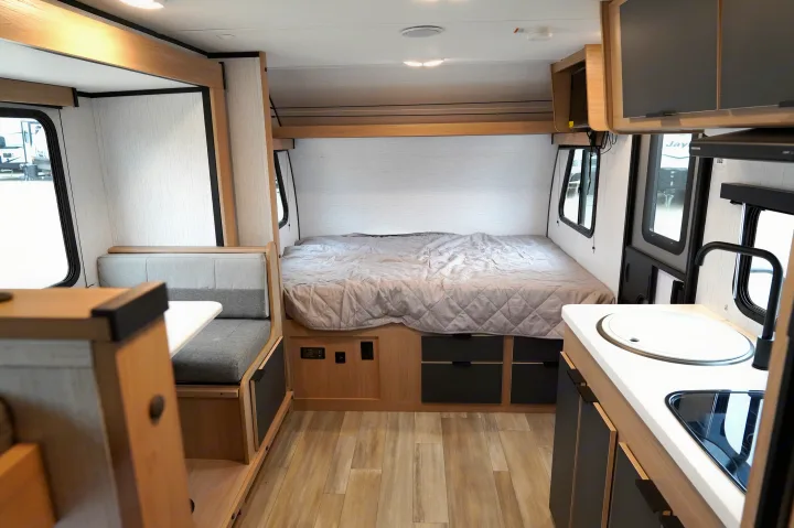 Spacious RV rental interior with a comfy bed, cozy dinette, and functional kitchen. Perfect for your next adventure.. Cruiser Rv Corp Hitch 2022