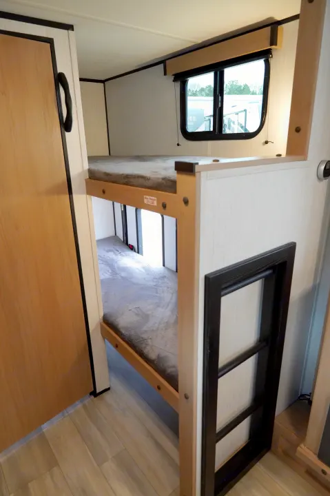 Inside an RV rental: modern bunk beds with a window, designed for comfortable travel sleep.. Cruiser Rv Corp Hitch 2022