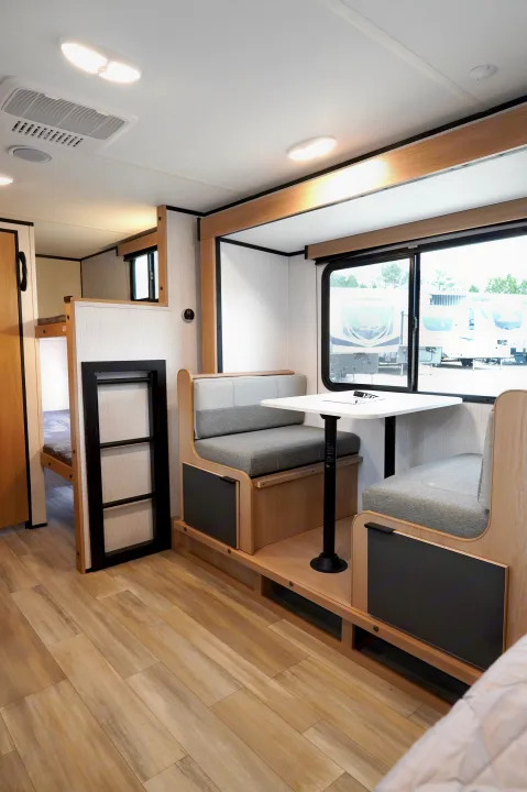 RV rental: Spacious interior with a dinette, large window, and bunk beds. Ideal for travel trailer adventures.. Cruiser Rv Corp Hitch 2022