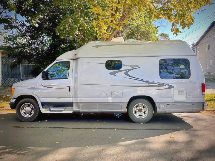 This light gray Pleasure-Way van RV is parked on a sunny street, ideal for your next rv rental adventure.. Pleasure Way Excel 2007