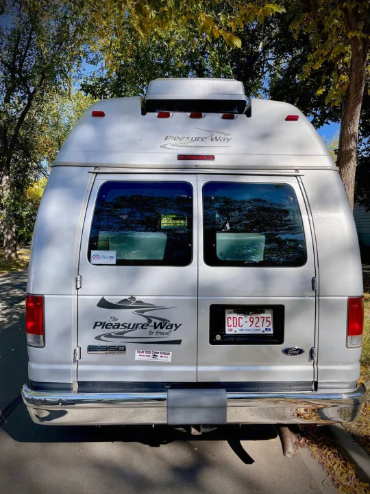 Rear view of a silver Pleasure-Way RV. This camper van is ideal for your next rv rental and memorable road trips.. Pleasure Way Excel 2007