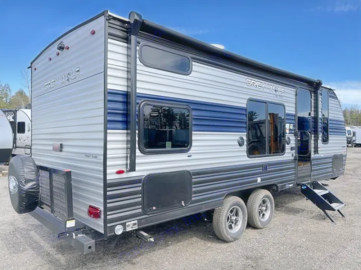 Spacious Grey Wolf travel trailer, ideal for RV rental. Silver & blue exterior, dual axles, and steps ready for adventure.. Forest River Cherokee Grey Wolf Special Edition 2022
