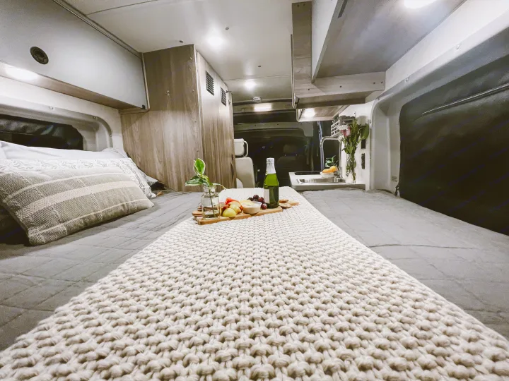 This cozy RV rental offers a comfy bed with snacks, a kitchenette, and overhead storage for your next adventure.. Winnebago Solis 59PX 2023
