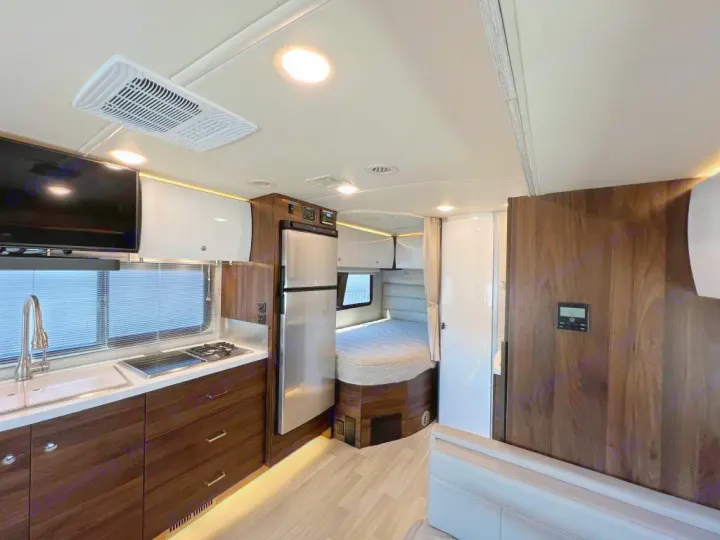 Spacious RV rental interior featuring a modern kitchen, bedroom, and comfortable living space.. Winnebago View 2023