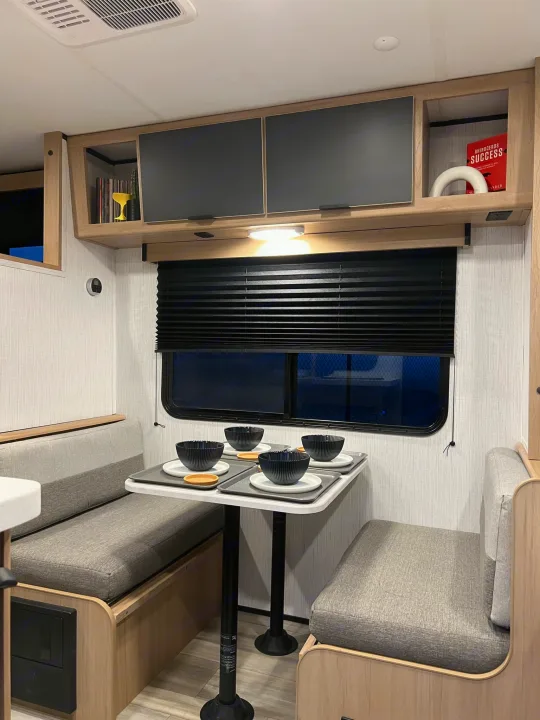 Dining area fits 4, and includes additional overhead storage. Also converts to additional sleeping for 1 adult or 2 kids.. Cruiser RV Hitch 2022