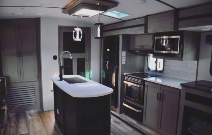 KITCHEN WITH ISLAND W/OVERHEAD SKYLIGHT  - PLENTY OF SPACE FOR PREPARING + ENJOYING MEALS! COMES STOCKED WITH EVERYTHING YOU'D NEED!. Other Other 2021