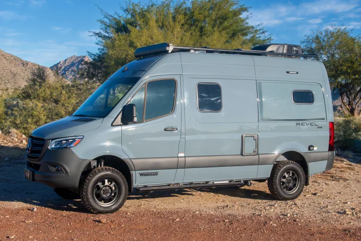 Explore the outdoors with this gray Winnebago Revel 4x4 camper van, perfect for an rv rental adventure.. Winnebago Revel 2023