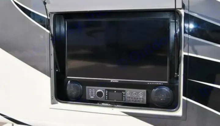 An RV rental features an open exterior entertainment compartment with a flat-screen TV, stereo, and speakers.. Jamboree Jamboree Motorhome 2017