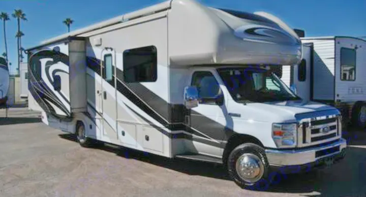 Modern Class C motorhome rv rental parked outdoors. White & gray with black graphics, it's ready for your next adventure.. Jamboree Jamboree Motorhome 2017