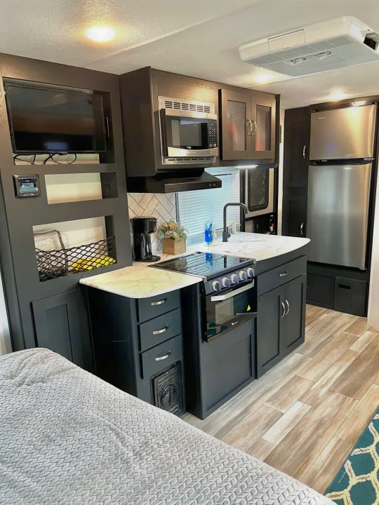 TV can adapt to tablets so you can still enjoy your favorite apps, like Netflix or Disney.  Large pantry and refrigerator. . Coachmen Freedom Express 2022