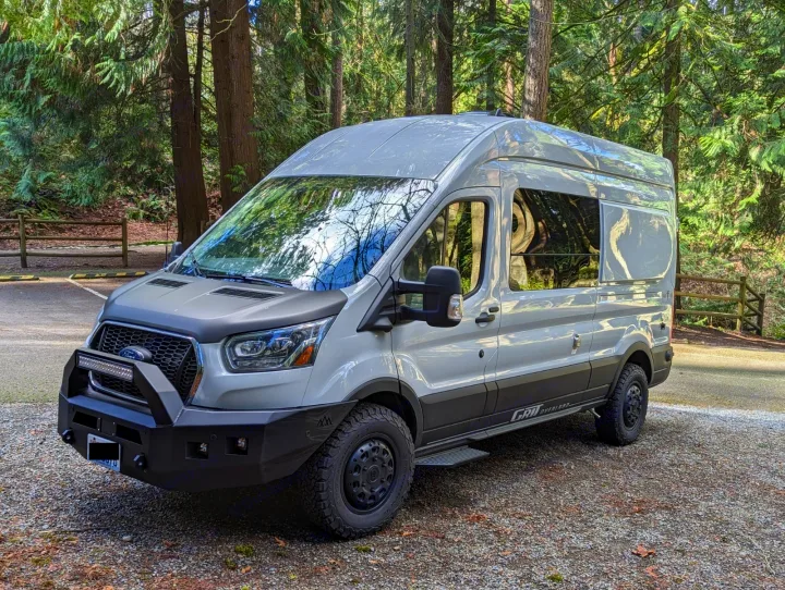 This rugged Ford Transit adventure van with off-road tires is ready for your next rv rental trip!. Grit Overland GO A/T 2022