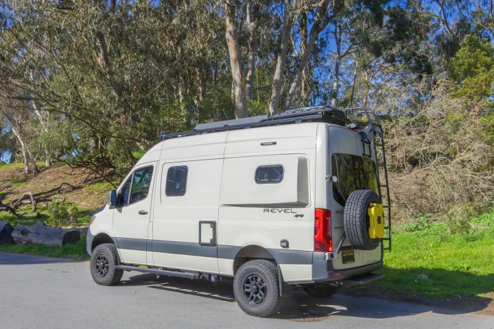 Explore with this white Winnebago Revel 4x4 camper van, an ideal rv rental for outdoor adventures.. Other Revel 2023