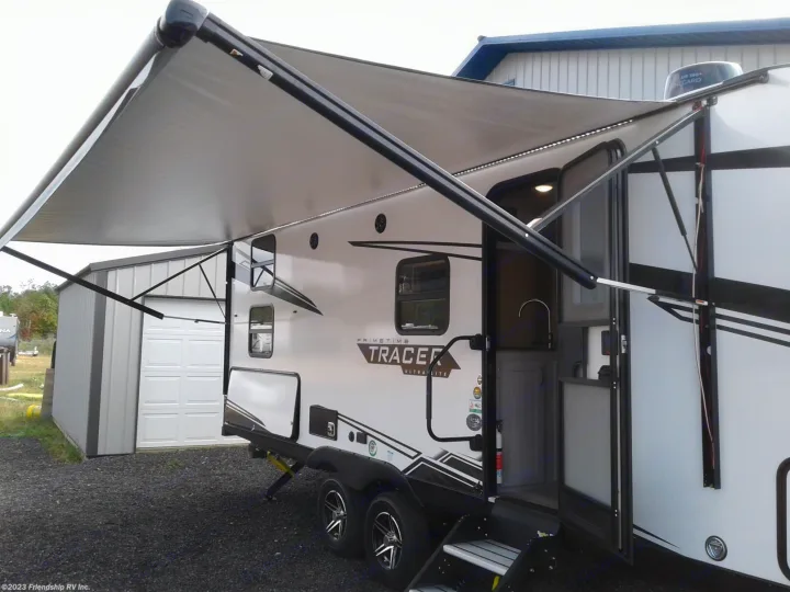 This white Primetime Tracer Ultra Lite RV with an extended awning and outdoor kitchen is ready for your next RV rental adventure.. Forest River Tracer 2022