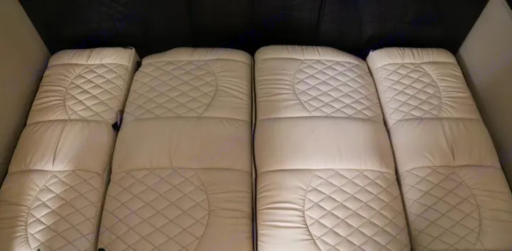 Comfortable, quilted white bedding provides cozy sleeping areas in this RV rental's interior.. Midwest Automotive Designs Daycruiser 2019