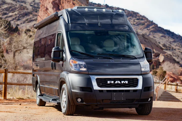 Front view of a dark grey Ram ProMaster camper van RV rental, ideal for exploring rocky landscapes.. Thor Tellaro 2023
