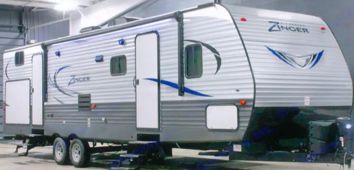 Spacious grey and black Zinger travel trailer for your next rv rental adventure, featuring multiple doors & windows.. Crossroads Zinger 2017