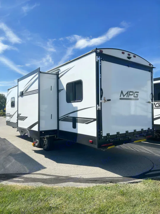 Explore this white RV with an extended slide-out and rear ramp, perfect for your next rv rental adventure.. Cruiser Rv Corp MPG 2700TH 2022