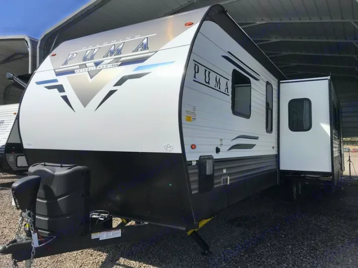This Puma travel trailer, perfect for your next RV rental adventure, features a spacious slide-out section.. Forest River Palomino Puma 2022