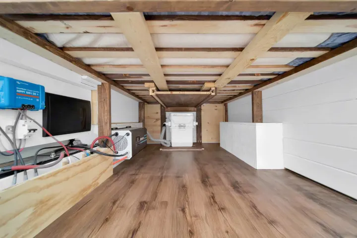 Explore this RV rental's under-bed storage: integrated solar charge controller, inverter, & essential utilities for off-grid travel.. Mercedez Sprinter 2015