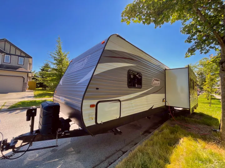 Spacious Coleman RV rental, parked on a sunny day with its slide-out extended, ready for your next adventure.. Coleman Lantern 28.6 RK 2018