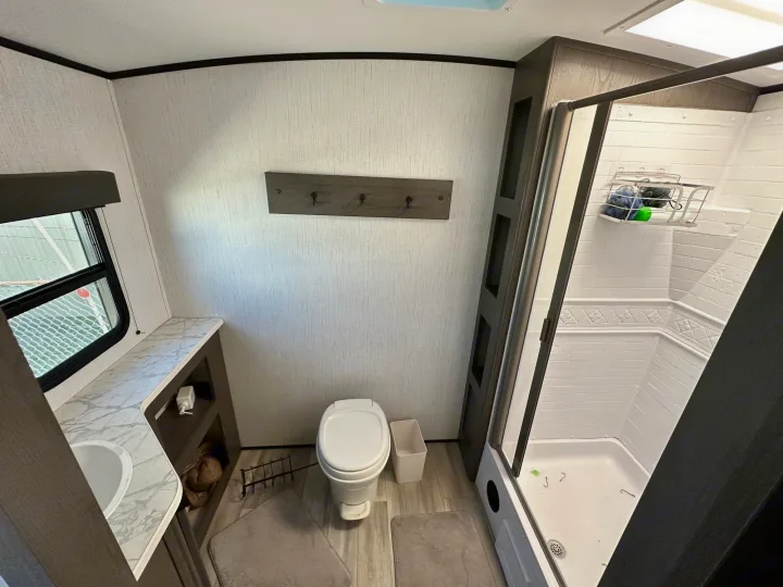 RV rental bathroom: Compact and functional interior with shower, toilet, and vanity. Perfect for travel.. Cruiser RV Embrace Ultra Lite 2022