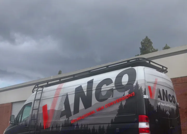 Large white van with "VANCO Recreational Van Conversions" graphics, roof rack, and ladder, ideal for RV rental.. Freightliner Sprinter 2012