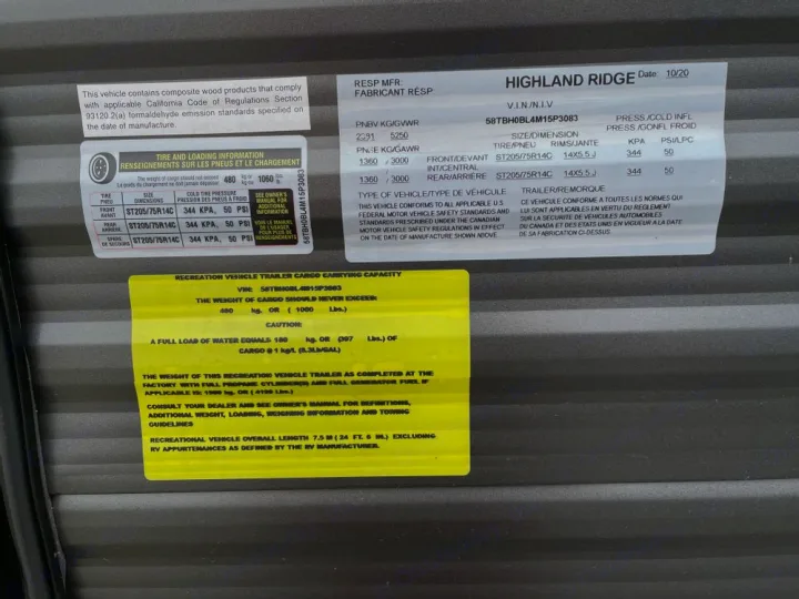 Essential RV rental info: Detailed labels displaying weight, tire pressure, and VIN on a Highland Ridge trailer.. Highland Ridge RV Open Range 2021