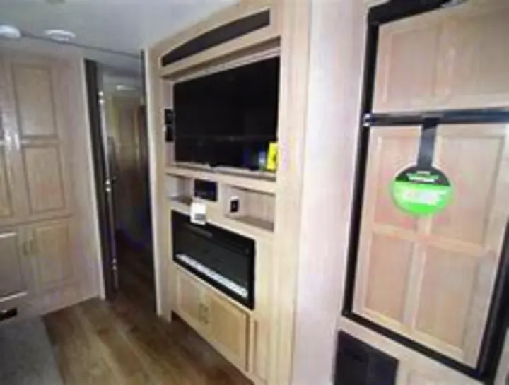 Explore comfort in this RV rental! The interior features a flat-screen TV, electric fireplace, and spacious refrigerator for your adventures.. Coachmen Other 2020