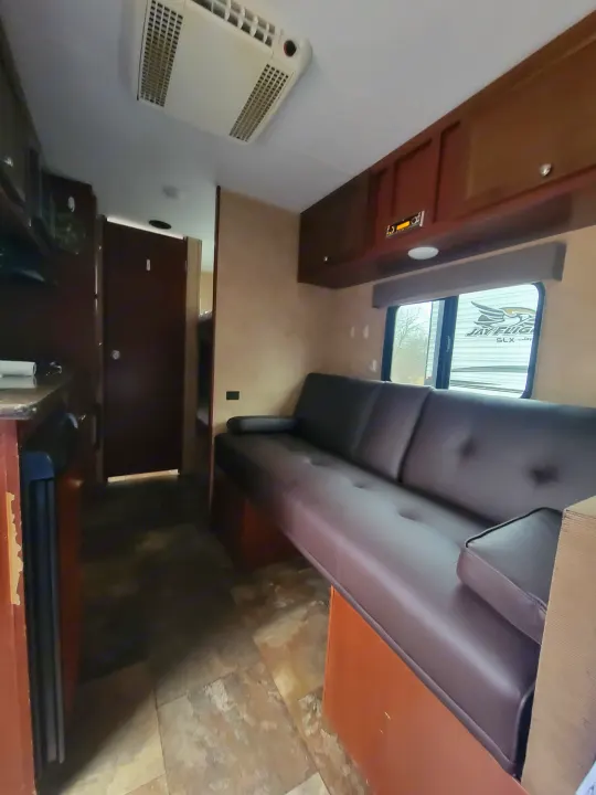 Sitting area that makes into sleeping area, and two single bunks in the back. Coachmen Clipper 2015