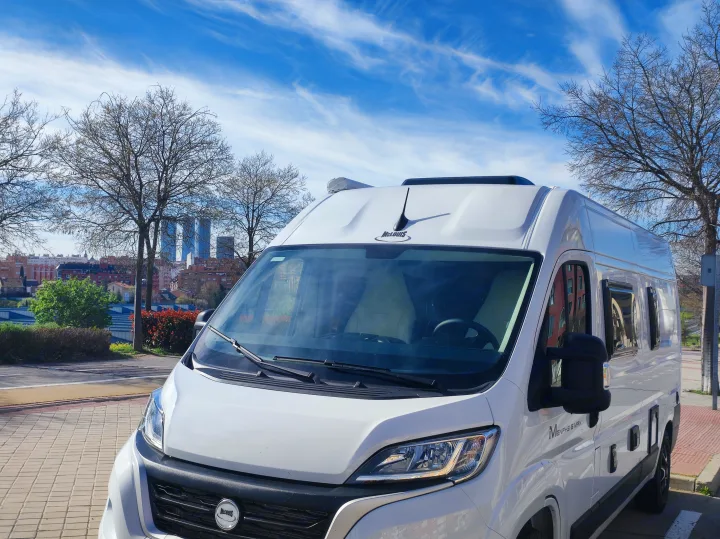 White McLouis Menfys S Max campervan, ideal for RV rental, parked in an urban landscape under blue skies.. McLouis MENFYS 3 MAXI 2026