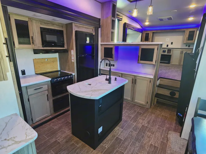 Kitchen & Dining area stocked with all the essentials and a coffee maker (k-cup compatible). Forest River Cherokee Arctic Wolf 2022