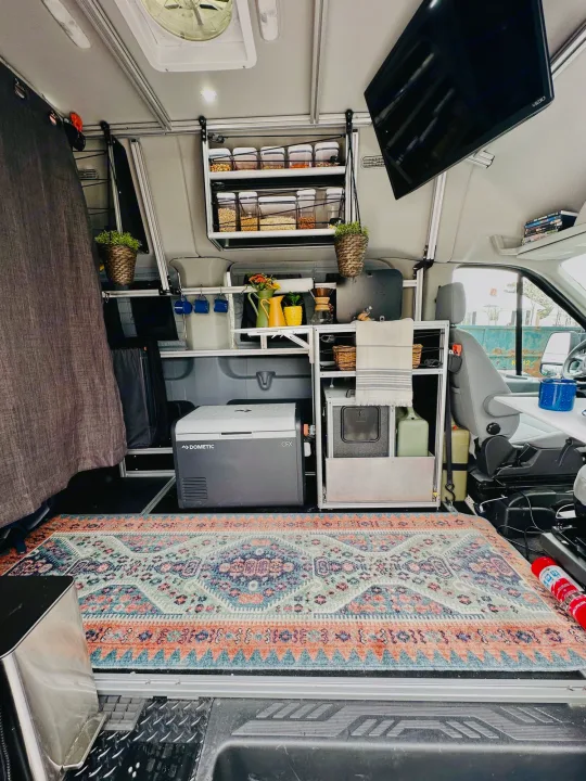 Explore mobile living in this organized camper van RV rental. Features compact kitchen, TV & smart storage.. Vandoit DO 2019